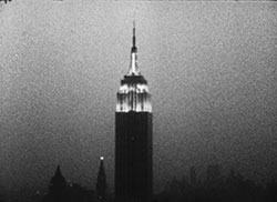 Andy Warhol, Empire, 1964; 16mm film, b/w, silent, 8 hours and 5 minutes at 16fps. © 2012 The Andy Warhol Museum, Pittsburgh, PA, a museum of Carnegie Institute. All rights reserved. Film still courtesy The Andy Warhol Museum.
