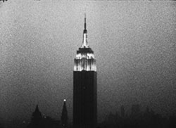 Andy Warhol, Empire, 1964; 16mm film, b/w, silent, 8 hours and 5 minutes at 16fps. &copy; 2012 The Andy Warhol Museum, Pittsburgh, PA, a museum of Carnegie Institute. All rights reserved. Film still courtesy The Andy Warhol Museum.